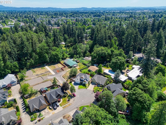 aerial view with a residential view and a view of trees