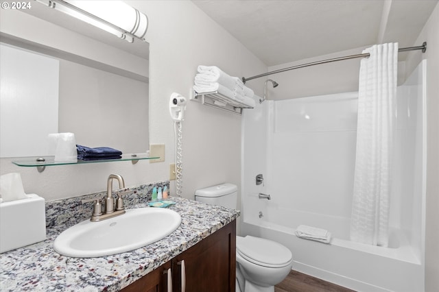 full bathroom featuring vanity, hardwood / wood-style floors, shower / tub combo with curtain, and toilet