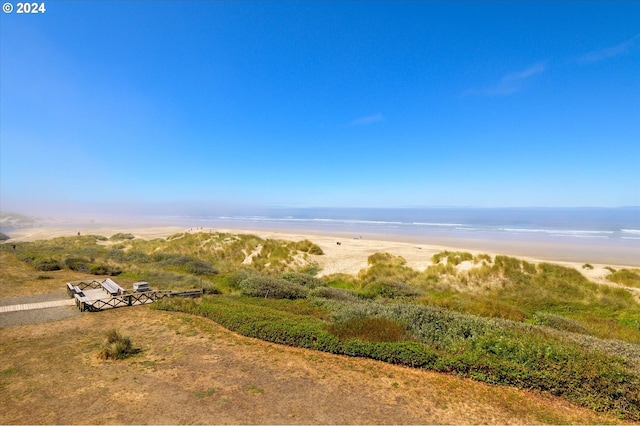 bird's eye view with a beach view and a water view