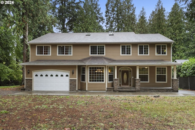 view of front facade featuring a garage and covered porch