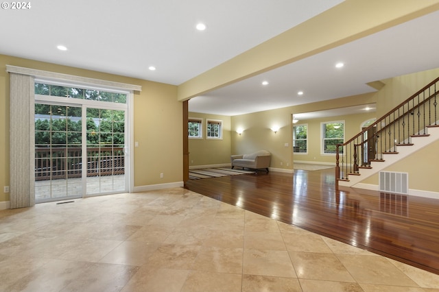 unfurnished living room featuring light hardwood / wood-style flooring