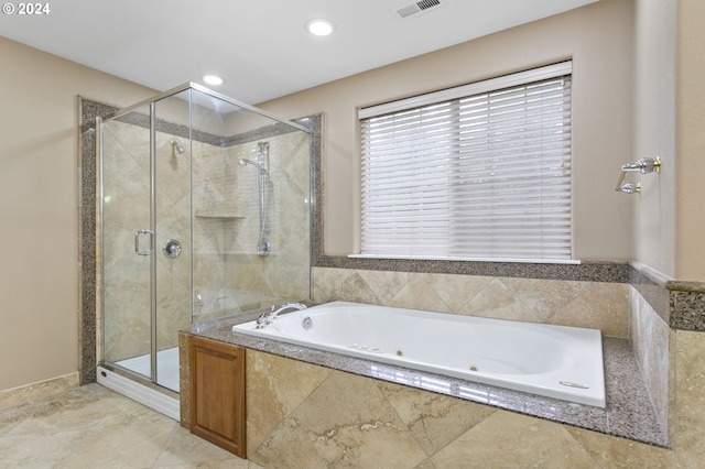 bathroom with shower with separate bathtub