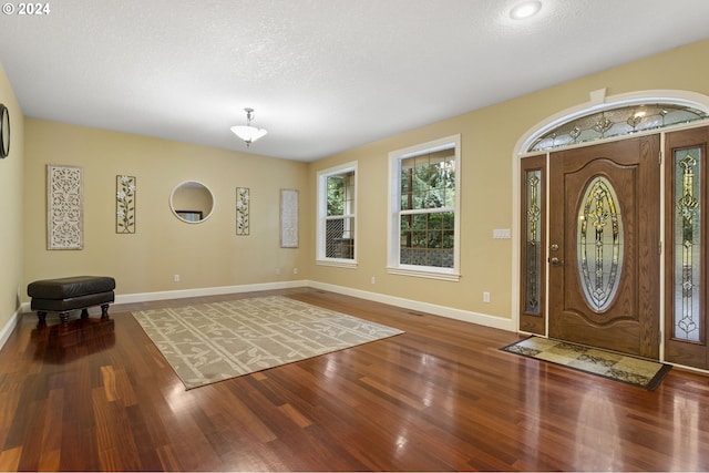 entrance foyer featuring hardwood / wood-style floors and a textured ceiling