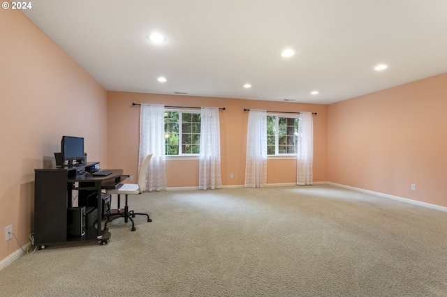 office area featuring light colored carpet