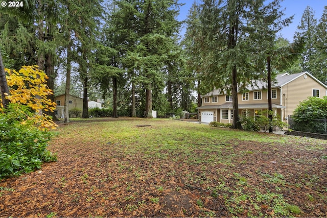 view of yard with a garage