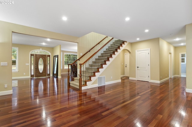 entrance foyer featuring dark hardwood / wood-style floors