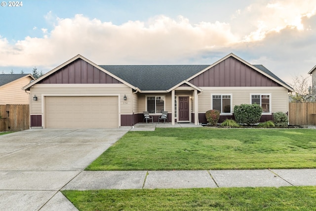 view of front of house with a front lawn and a garage