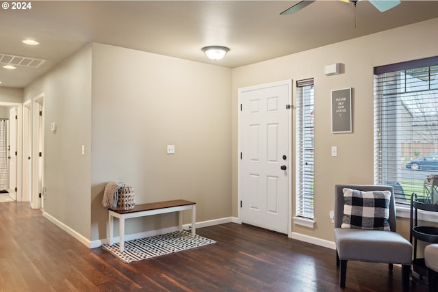 foyer with ceiling fan and dark wood-type flooring