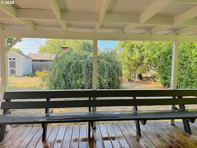 deck featuring a shed