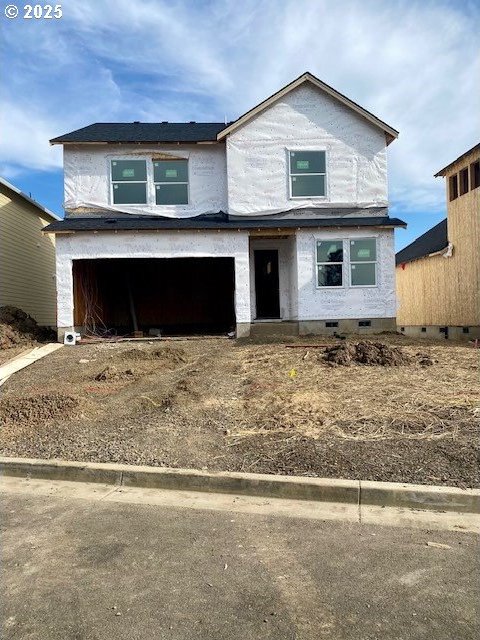 view of front of property with a garage and crawl space