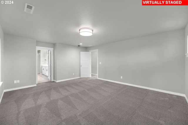 spare room with light colored carpet