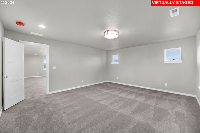 empty room with carpet flooring