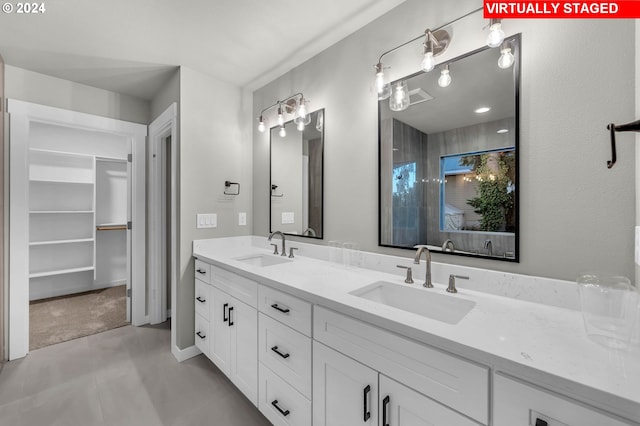 bathroom with vanity and tile patterned flooring