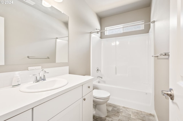 full bathroom featuring vanity, toilet, and shower / bathtub combination