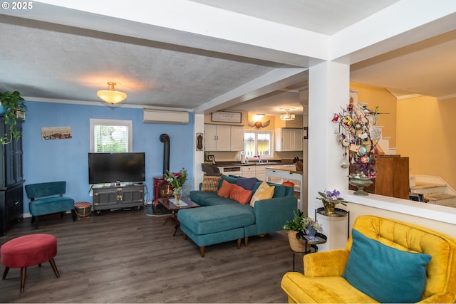 living room with dark hardwood / wood-style flooring, an AC wall unit, and crown molding