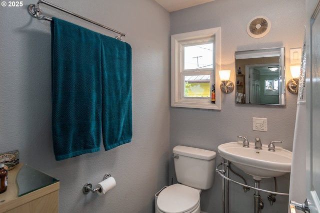 bathroom featuring sink and toilet