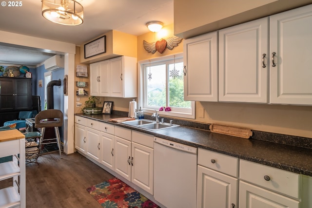 kitchen featuring white dishwasher, dark hardwood / wood-style floors, white cabinets, and an AC wall unit