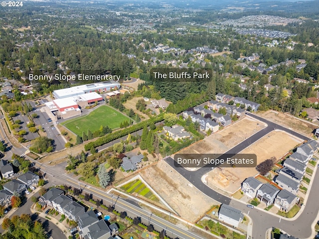 birds eye view of property with a residential view