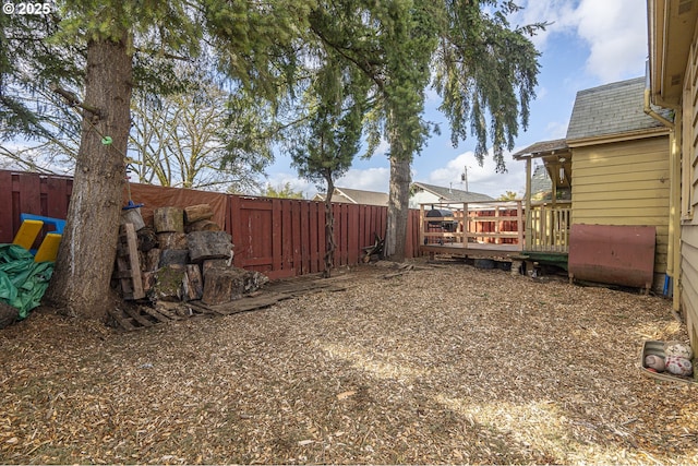 view of yard with heating fuel and a fenced backyard