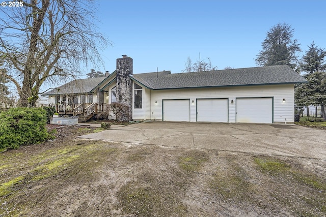 view of front of property with a garage