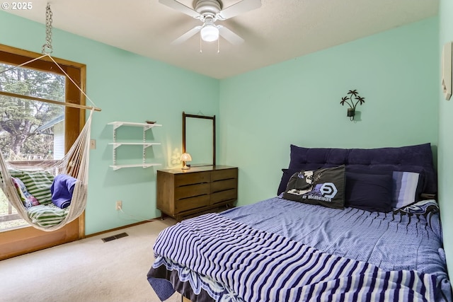 carpeted bedroom featuring ceiling fan