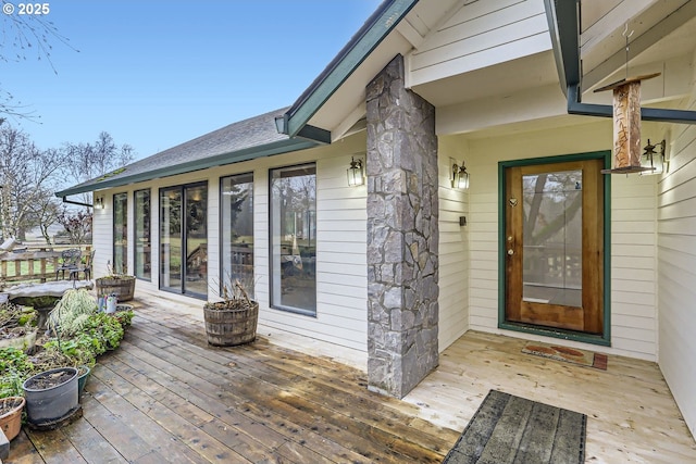 doorway to property with a wooden deck