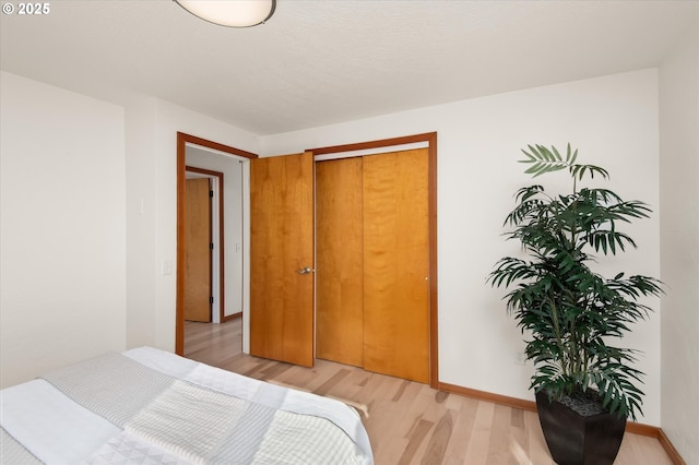 bedroom with light hardwood / wood-style floors