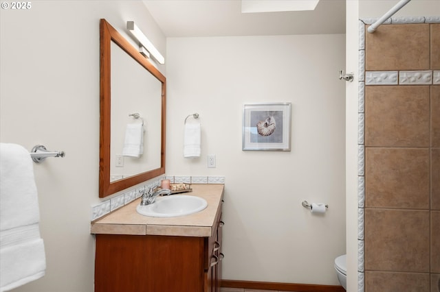 bathroom with vanity and toilet