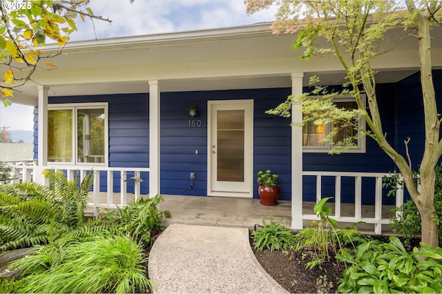 property entrance with covered porch