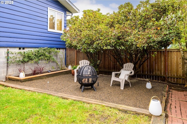 view of yard with an outdoor fire pit