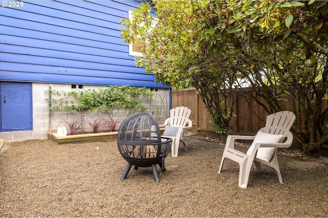 view of yard with a fire pit