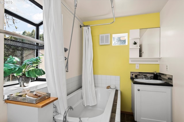 bathroom with vanity and shower / bath combo with shower curtain