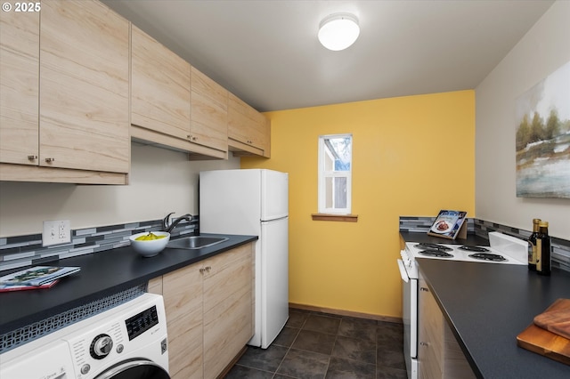 kitchen with washer / dryer, sink, light brown cabinetry, and white appliances