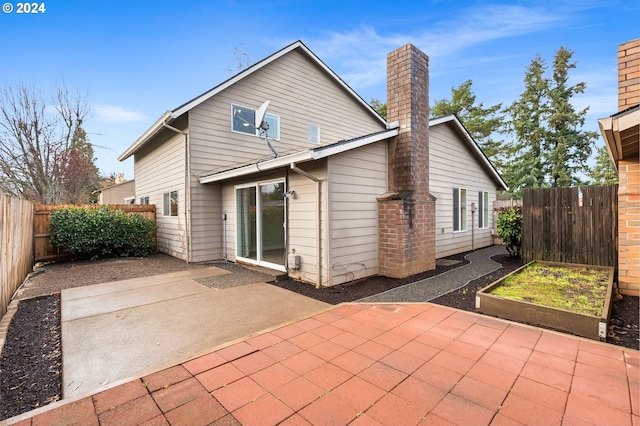 rear view of house with a patio area