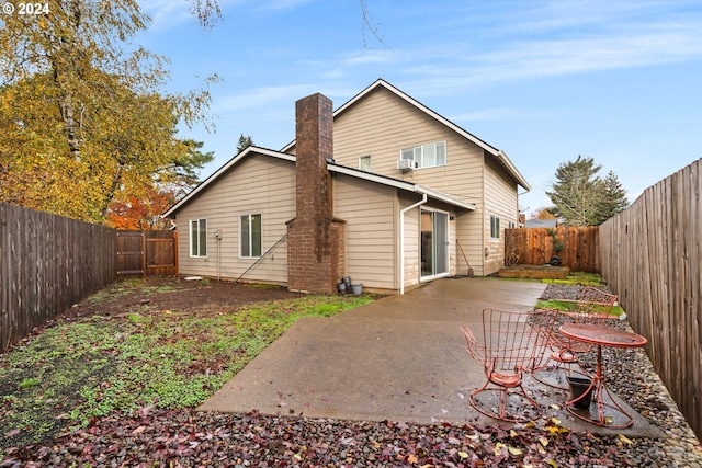 rear view of house with a patio