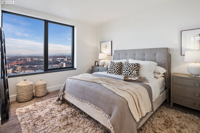 bedroom with baseboards and carpet flooring