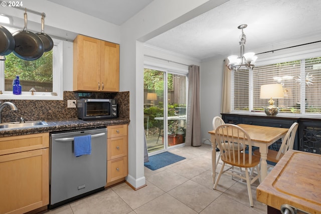 kitchen featuring dishwasher, tasteful backsplash, sink, light tile floors, and ornamental molding