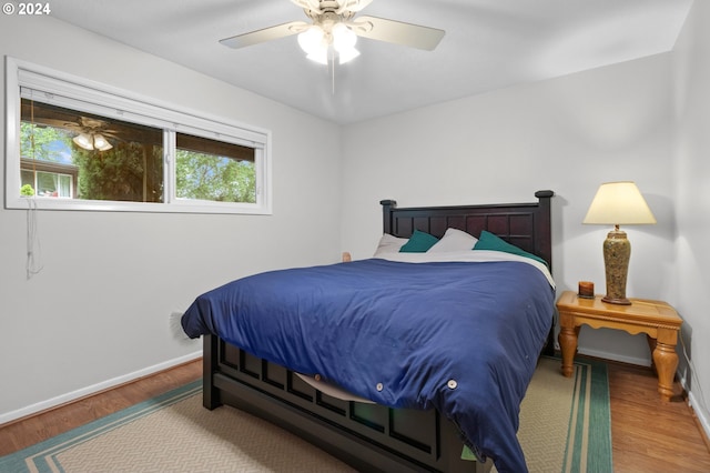 bedroom featuring ceiling fan and hardwood / wood-style flooring