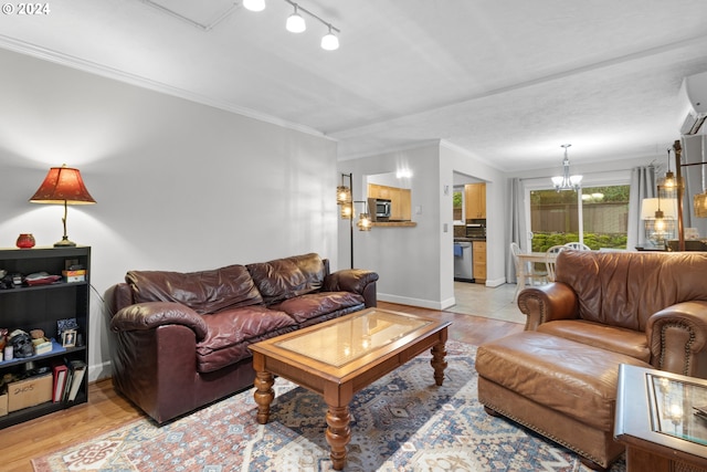 tiled living room with rail lighting, a notable chandelier, and crown molding