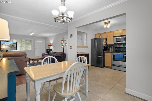 dining area featuring a chandelier, crown molding, and light wood-type flooring