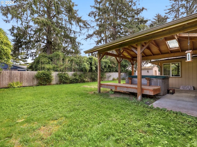 view of yard featuring a gazebo, a hot tub, and a patio area