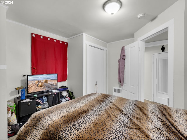 bedroom featuring crown molding