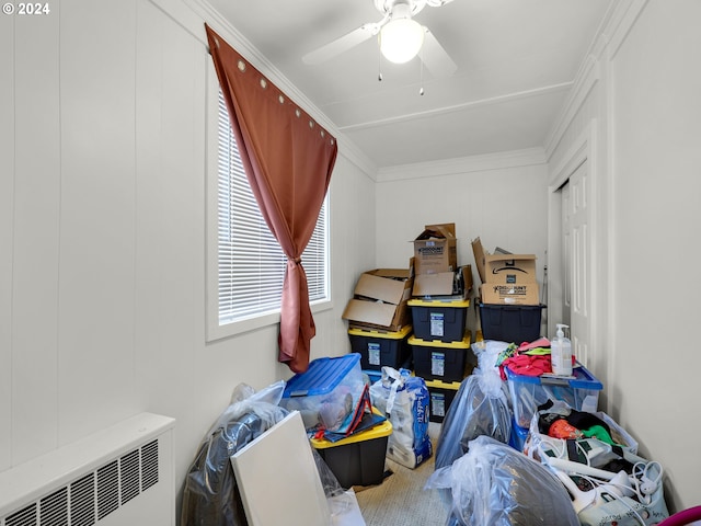 storage featuring radiator heating unit and ceiling fan