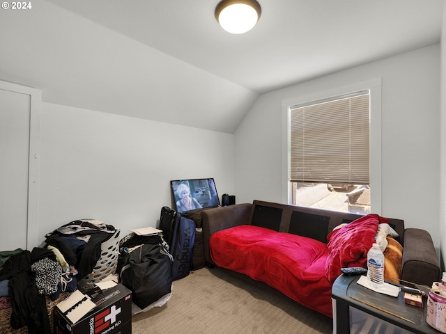 carpeted bedroom with vaulted ceiling