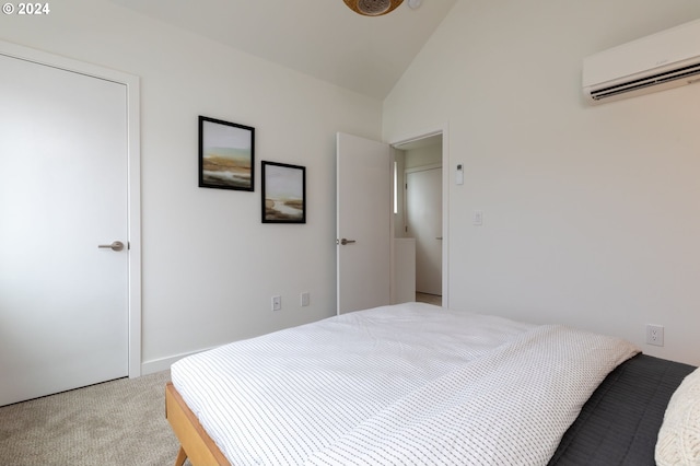 carpeted bedroom featuring lofted ceiling and a wall mounted air conditioner