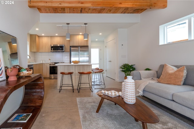 living room featuring sink, beamed ceiling, and wood ceiling