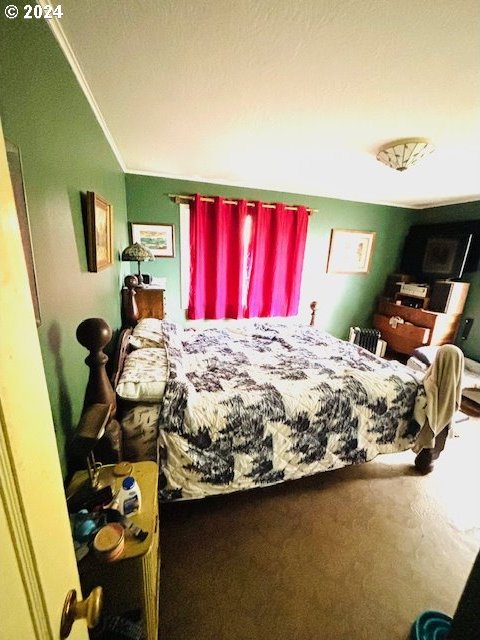 bedroom with ornamental molding