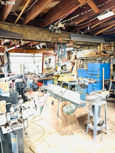 misc room featuring concrete floors and a workshop area