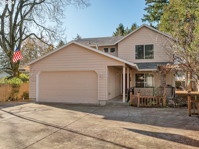 view of front of home with a porch and a garage