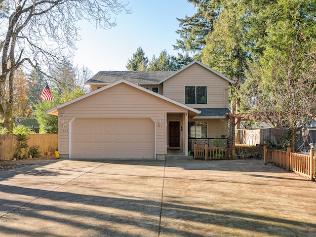 view of front property with a porch and a garage